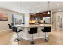 Modern kitchen with granite countertops and stainless steel appliances at 8150 Enclave Way # 104, Sarasota, FL 34243