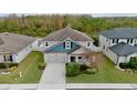 Two-story house situated in a residential neighborhood with surrounding homes visible at 12213 Streambed Dr, Riverview, FL 33579