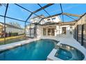 Inviting swimming pool and spa with a screened enclosure and backyard access at 14146 Cattle Egret Pl, Bradenton, FL 34202