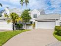 Gray siding townhome with a two-car garage and manicured lawn at 3523 52Nd W Ave, Bradenton, FL 34210