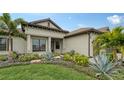 Attractive home exterior with lush landscaping and a welcoming entryway at 4810 Sparkling Sea Ln, Bradenton, FL 34211
