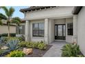 Front entrance with stone walkway and professionally designed landscaping at 4810 Sparkling Sea Ln, Bradenton, FL 34211