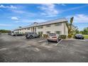Side view of condo building showing parking area at 5800 Hollywood Blvd # 115, Sarasota, FL 34231