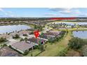 Community view showing home's location near a community center and lake at 6519 Rosehill Farm Run, Bradenton, FL 34211