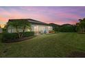 Spacious backyard oasis with patio, hot tub, and solar panels at 6519 Rosehill Farm Run, Bradenton, FL 34211