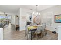 Bright dining room with a table, chairs, and access to kitchen at 7022 Prosperity Cir # 801, Sarasota, FL 34238