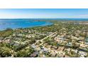 Beautiful aerial view of a neighborhood with waterfront access and lush landscaping in Florida at 919 82Nd Nw St, Bradenton, FL 34209