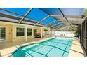 Inviting screened-in pool area featuring a covered patio, perfect for relaxing and entertaining at 919 82Nd Nw St, Bradenton, FL 34209