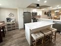 Modern kitchen with white cabinets, stainless steel appliances, and an island at 9320 Clubside Cir # 2105, Sarasota, FL 34238