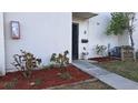 Condo entrance with walkway and neatly landscaped area at 1007 Longfellow Cir, Sarasota, FL 34243