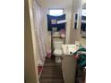 Clean bathroom with a shower/tub combo and updated flooring at 1519 30Th St, Sarasota, FL 34234