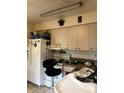 Bright kitchen features white appliances and light wood cabinets at 1519 30Th St, Sarasota, FL 34234