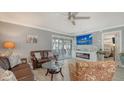 Spacious living room with fireplace and sliding doors to patio at 205 Oak Hill Dr # 7, Sarasota, FL 34232