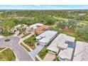 Community overview showcasing multiple houses and lush green landscape at 230 Vestavia Dr, Venice, FL 34292