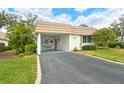 White home with carport and driveway at 2325 Riverbluff Pkwy # V247, Sarasota, FL 34231