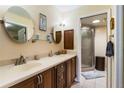 Double vanity bathroom with a walk-in shower at 33931 Serene Dr, Punta Gorda, FL 33982