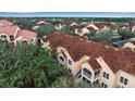 Aerial view of condo building with Spanish tile roofs at 4122 Central Sarasota Pkwy # 1914, Sarasota, FL 34238