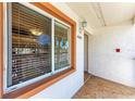 Condo entry with a light brown door and tiled flooring at 4366 Madeira Ct # 3356, Sarasota, FL 34233
