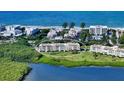 Aerial view of condo building near the water and beach at 4600 Gulf Of Mexico Dr # 206, Longboat Key, FL 34228