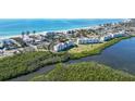 Aerial view showcasing a condo community near the beach at 4600 Gulf Of Mexico Dr # 206, Longboat Key, FL 34228