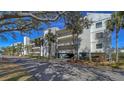 Condo building exterior showcasing architectural details and landscaping at 4600 Gulf Of Mexico Dr # 206, Longboat Key, FL 34228