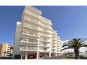 Condo building exterior showcasing architectural details at 5830 Midnight Pass Rd # 502, Sarasota, FL 34242