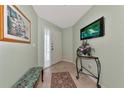 Bright condo entryway with decorative table and bench at 829 Audubon Dr # 829, Bradenton, FL 34209