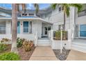 Condo entrance with walkway, landscaping, and white building exterior at 829 Audubon Dr # 829, Bradenton, FL 34209