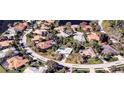 Bird's eye view of a residential neighborhood with houses and lush greenery at 8303 Deerbrook Cir, Sarasota, FL 34238