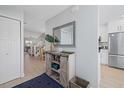 Bright and airy entryway with built-in storage at 1275 Siesta Bayside Dr # 1275, Sarasota, FL 34242