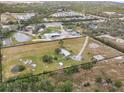 Aerial view showing home, land, and outbuildings at 19990 E State Road 64, Bradenton, FL 34212