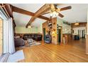 Cozy living room with wood floors, a fireplace, and comfortable leather seating at 217 46Th W St, Bradenton, FL 34209
