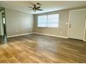 Spacious living area with wood-look flooring and ceiling fan at 360 Flamingo Rd, Venice, FL 34293