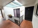 Condo hallway with access to unit and skylight at 3805 E Bay Dr # 302, Holmes Beach, FL 34217