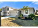 Two story house with a two car garage and nicely landscaped lawn at 4109 Quiet Rain Ct, Palmetto, FL 34221