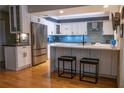 Modern kitchen featuring white cabinets, quartz countertops, and stainless steel appliances at 4258 Marlowe Dr, Sarasota, FL 34241