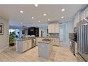 Spacious kitchen with an island and stainless steel appliances at 5522 69Th E Pl, Ellenton, FL 34222