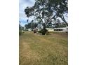 Community with mature trees and well-maintained lawns at 5931 Tidewood Ave # 8, Sarasota, FL 34231