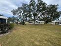 Community featuring several yellow houses and lush landscaping at 5931 Tidewood Ave # 8, Sarasota, FL 34231