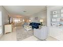 Bright and airy living room with ample seating and large windows at 6005 Midnight Pass Rd # N8, Sarasota, FL 34242