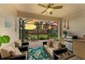Outdoor kitchen and seating area with view of the sunset at 6273 Winding Pine Dr, Nokomis, FL 34275