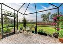 Relaxing screened patio with brick pavers and lush greenery at 6273 Winding Pine Dr, Nokomis, FL 34275