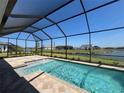 Screened pool and spa with lake view at 8528 Beechlake Ct, Sarasota, FL 34240