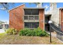 Brick building exterior with screened balcony and landscaping at 9100 Dr Martin Luther King Jr N St # 1302, St Petersburg, FL 33702