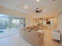 Spacious living room with a view of the pool and patio at 12338 Lavender Loop, Bradenton, FL 34212