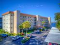 Exterior of a low rise condominium community with covered parking and waterfront views at 1600 1St W Ave # 304A, Bradenton, FL 34205