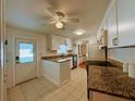 Updated kitchen with granite countertops and white cabinets at 2107 Palma Sola Blvd # 42, Bradenton, FL 34209