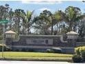 Community entrance sign for Cedar Grove at the Woodlands at 2536 Marton Oak Blvd, North Port, FL 34289