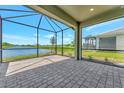 Screened porch overlooking pond and backyard at 25917 Bimini Sands Ct, Englewood, FL 34223