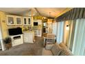 Cozy kitchen with light wood cabinets and an eat-in dining area at 289 Bainbridge Dr, Nokomis, FL 34275